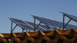 Solar energy panels installed on a wooden roof for sustainable power generation.